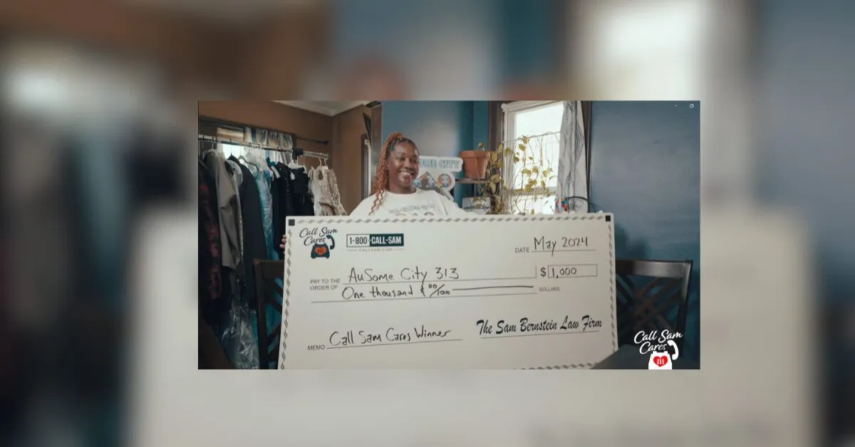 woman holding large format check